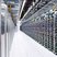 A large mining farm showcasing multiple rows of ASIC miners in a climate-controlled environment.